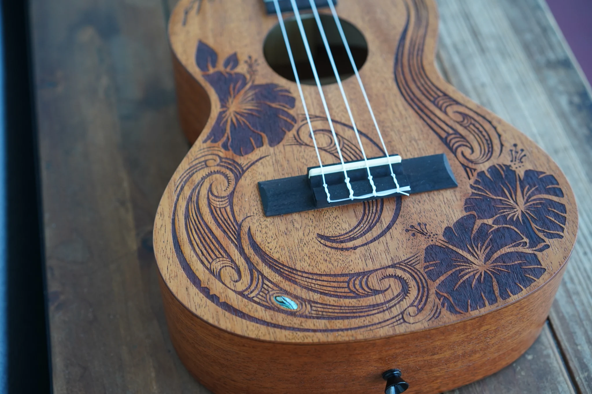 Kala Unity Mahogany Tenor Ukulele front view with laser-etched Unity artwork