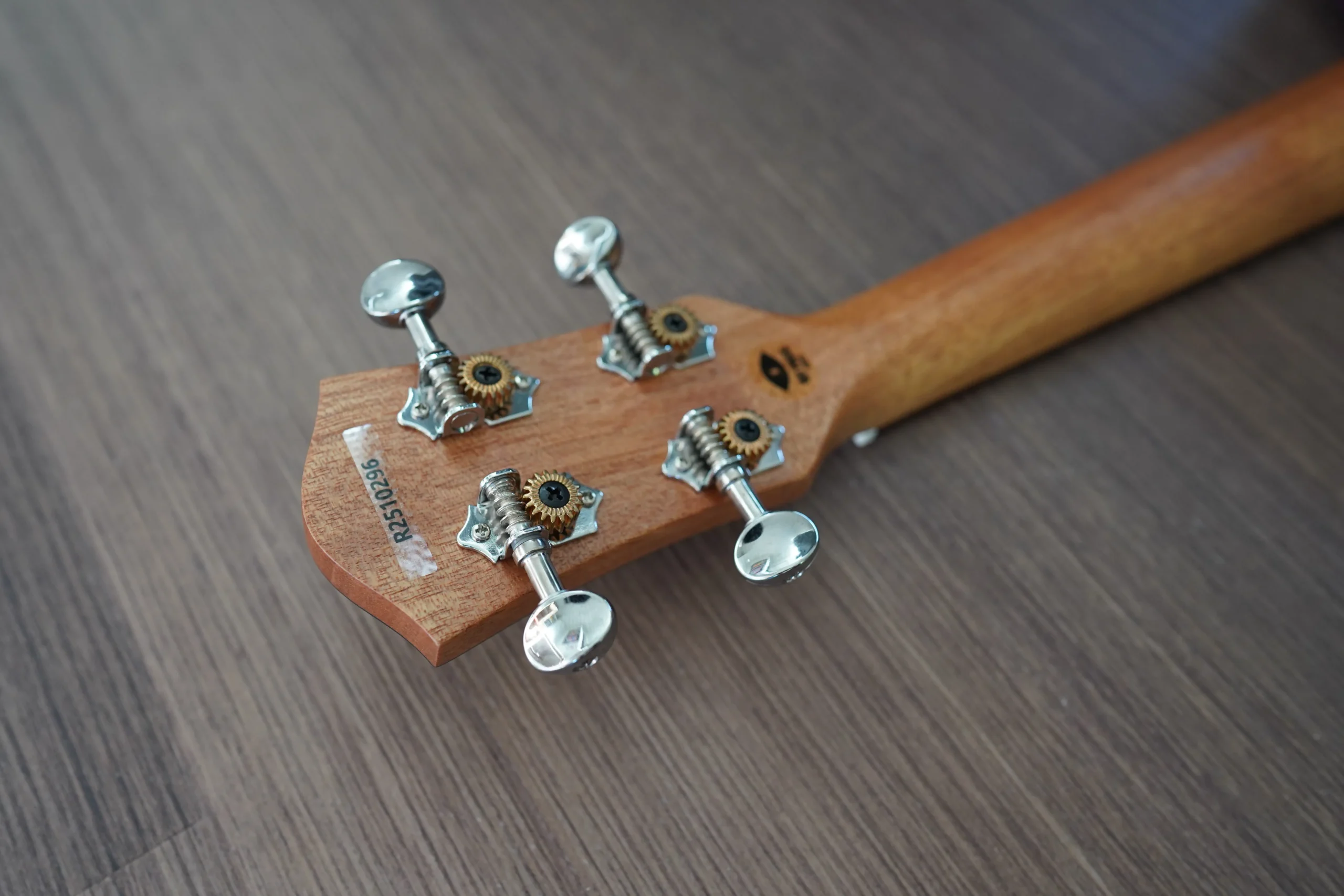 Rear view of the Flight DUC 400 Ash Purple ukulele headstock featuring open-gear chrome tuning machines.
